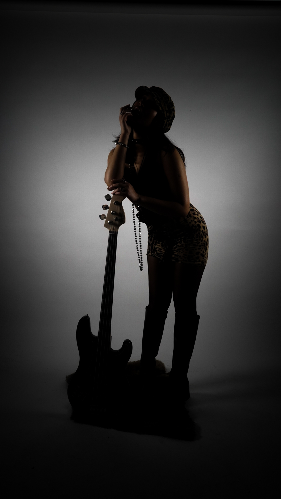 Silhouette portrait with bass guitar